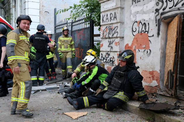 Rescuers rest during a response effort to a fire at the Kharkiv Art Museum, damaged by a Russian drone strike, Kharkiv, Ukraine, June 14, 2026. The Russian army attacked the northeastern city with drones, injuring five people, including a one-month-old baby. On the afternoon of June 14, Russians struck two districts of Kharkiv with drones. (Photo by Viacheslav Madiievskyi Ukrinform) Russians strike Kharkiv Art Museum with drone  Copyright: xViacheslavxMadiievskyix