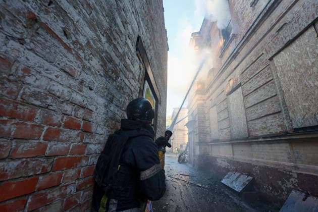 A rescuer pours water to extinguish a fire at the Kharkiv Art Museum, caused by a Russian drone strike, Kharkiv, Ukraine, June 14, 2026. The Russian army attacked the northeastern city with drones, injuring five people, including a one-month-old baby. On the afternoon of June 14, Russians struck two districts of Kharkiv with drones. (Photo by Viacheslav Madiievskyi Ukrinform) Russians strike Kharkiv Art Museum with drone  Copyright: xViacheslavxMadiievskyix