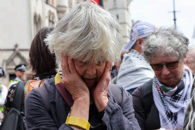 June 15, 2026, London, London, UK: London, UK. People react outside the Royal Courts of Justice in central London as they listen to court proceedings after the Court of Appeal ruled that the government s proscription of Palestine Action as a terrorist organisation is lawful, upholding the ban following a legal challenge. London UK  - ZUMAl94_ 20260615_zaf_l94_028 Copyright: xDinendraxHariax