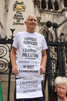June 15, 2026, London, London, UK: London, UK. A supporter of Palestine Action holds a placard during a protest outside the Royal Courts of Justice in London ahead of the court s judgment on the government s appeal over the proscription of Palestine Action under terrorism laws. London UK  - ZUMAl94_ 20260615_zaf_l94_043 Copyright: xDinendraxHariax