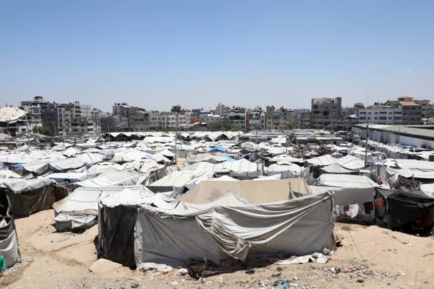 Displacement tents crowd ruins in western Gaza City Tents sheltering displaced Palestinians stand among the rubble of destroyed buildings in western Gaza City on June 15, 2026. Displaced residents continue to face mounting challenges due to damaged infrastructure and shortages of basic services, while cases of skin diseases among children are increasing in displacement camps and shelters across the Gaza Strip. Photo by Bilal Osama apaimages Gaza city Gaza Strip Palestinian Territory 150626_Gaza_BO_02(5) Copyright: xapaimagesxBilalxOsamax xapaimagesx