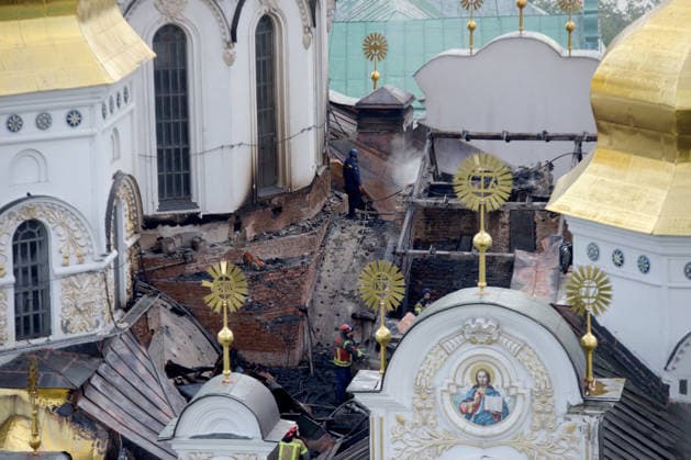 A firefighter works on the roof of the Dormition Cathedral at the Kyiv Pechersk Lavra that caught fire during a massive Russian combined attack, Kyiv, Ukraine, June 15, 2026. The Russian army launched a large-scale assault on the Ukrainian capital with missiles and strike drones, killing four people and injuring 28, including children and a pregnant woman. At least 140,000 consumers were left without electricity due to damage to power grids. Residential buildings, the Kyiv Pechersk Lavra, the Mystetskyi Arsenal Museum Complex, the Dovzhenko Film Studio, and the building of the High Anti-Corruption Court sustained damage. (Photo by Marianna Kotyk Ukrinform) Massive Russian attack damages Kyiv Pechersk Lavra and Mystetskyi Arsenal in Kyiv  Copyright: xMariannaxKotykx