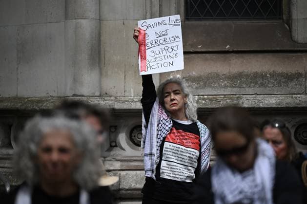 UK Court of appeal s Palestine Action decision protested in London LONDON, UK - JUNE 15: A demonstrator holds a placard reading Saving Lives Is Not Terrorism - Support Palestine Action during a protest outside the Royal Courts of Justice in London, United Kingdom on June 15, 2026. The demonstration was staged after the UK Court of Appeal upheld the government s decision to designate the pro-Palestinian activist group Palestine Action as a terrorist organization, which led to police intervention and multiple arrests. Rasid Necati Aslim Anadolu London United Kingdom. Editorial use only. Please get in touch for any other usage.  Copyright: x2026xAnadoluxRasidxNecatixAslimx