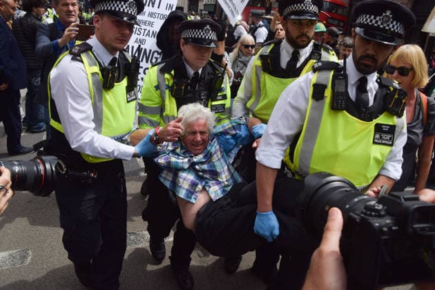 June 15, 2026, London, England, United Kingdom: Police officers arrest a protester outside the Royal Courts of Justice as the ban on the activist group Palestine Action is ruled as lawful by the Court of Appeal. Judges have overturned a previous ruling that the ban on the group was wrong. Protesters sat outside the court with placards stating Ã¢â‚¬ËœSaving lives is not terrorism, I support Palestine ActionÃ¢ London United Kingdom - ZUMAv130 20260615_zip_v130_007 Copyright: xVukxValcicx