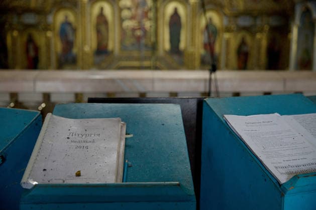 Massive Russian Attack Damages Kyiv Pechersk Lavra and Mystetskyi Arsenal - Kyiv Liturgical books, covered with dust, lie on analogions in the Dormition Cathedral at the Kyiv Pechersk Lavra, where the roof caught fire during a massive Russian combined attack, Kyiv, Ukraine, June 15, 2026. The Russian army launched a large-scale assault on the Ukrainian capital with missiles and strike drones, killing four people and injuring 28, including children and a pregnant woman. At least 140,000 consumers were left without electricity due to damage to power grids. Residential buildings, the Kyiv Pechersk Lavra, the Mystetskyi Arsenal Museum Complex, the Dovzhenko Film Studio, and the building of the High Anti-Corruption Court sustained damage. (Photo  Copyright: xUkrinform ABACAx