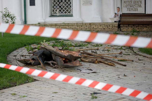 Massive Russian Attack Damages Kyiv Pechersk Lavra and Mystetskyi Arsenal - Kyiv Debris lies on the ground behind barricade tape at the Kyiv Pechersk Lavra, where the roof of the Dormition Cathedral caught fire during a massive Russian combined attack, Kyiv, Ukraine, June 15, 2026. The Russian army launched a large-scale assault on the Ukrainian capital with missiles and strike drones, killing four people and injuring 28, including children and a pregnant woman. At least 140,000 consumers were left without electricity due to damage to power grids. Residential buildings, the Kyiv Pechersk Lavra, the Mystetskyi Arsenal Museum Complex, the Dovzhenko Film Studio, and the building of the High Anti-Corruption Court sustained damage. (Photo by Mar  Copyright: xUkrinform ABACAx