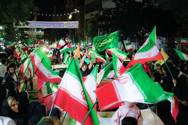 June 15, 2026, Tehran, Iran: Crowds wave Iranian flags along a street during a state-organized rally in Iran. Iran s foreign ministry said the United States had damaged international diplomatic efforts to end the war after further U.S. strikes on targets in southern Iran, while U.S. President Donald Trump said a deal with Iran could be signed and that the strategic Strait of Hormuz would be open to all immediately afterwards. Iran s Fars news agency, citing a well-informed source close to the Iranian negotiating team, reported that Tehran had not yet made or announced a final decision on any deal. Tehran Iran - ZUMAi98_ 20260615_zih_i98_011 Copyright: xIranianxSupremexLeader sxOfficex