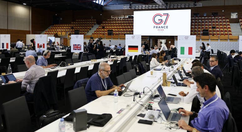 (260615) -- EVIAN, June 15, 2026 -- People work in the G7 summit International Media Centre in Publier, France, June 15, 2026. The Group of Seven (G7) summit kicked off on Monday in Evian, a town in eastern France, against the backdrop of massive demonstration. ) FRANCE-EVIAN-G7 SUMMIT-KICK OFF WuxHuiwo 