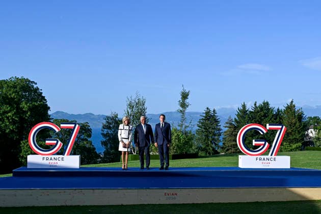 France s President Emmanuel Macron (R), his wife Brigitte Macron (L) greets European Council President Antonio Costa during the official greeting as part of the G7 summit, in Evian, eastern France, on June 15, 2026. A G7 summit is set to take place June 15 to 17 in the French town of Evian-les-Bains near Switzerland and it will be attended by country leaders as well as the EU s foreign policy chief and ministers from Brazil, Canada, the United Arab Emirates and Turkey.  FRN2026061508 EuropeanxUnion