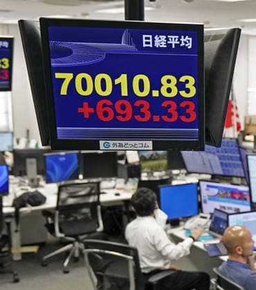 Nikkei rises above 70,000 for 1st time A financial data monitor at a foreign exchange trading company in Tokyo shows the 225-issue Nikkei Stock Average rising above 70,000 for the first time on June 16, 2026.  A14AA0005619009P