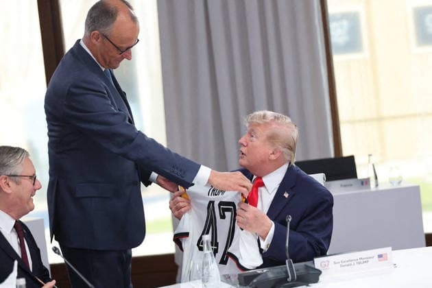G7 Summit - Merz Presents Trump With German Football Jersey Germany s Chancellor Friedrich Merz presents US President Donald Trump with a German national football team jersey with the number 47 on it as British Prime Minister Keir Starmer looks on during a working session at the G7 summit in Evian-les-Bains, central-eastern France on June 16, 2026. Photo by Dominique Jacovides Pool ABACAPRESS.COM Evian France  Copyright: xJacovidesxDominique Pool ABACAx