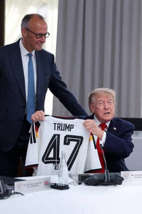 G7 Summit - Merz Presents Trump With German Football Jersey Germany s Chancellor Friedrich Merz presents US President Donald Trump with a German national football team jersey with the number 47 on it as British Prime Minister Keir Starmer looks on during a working session at the G7 summit in Evian-les-Bains, central-eastern France on June 16, 2026. Photo by Dominique Jacovides Pool ABACAPRESS.COM Evian France  Copyright: xJacovidesxDominique Pool ABACAx