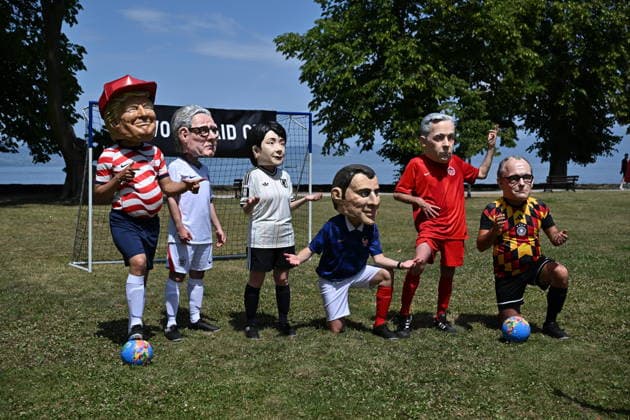 Oxfam protest ahead of G7 Summit in France EVIAN-LES-BAINS, FRANCE - JUNE 16: Activists wearing oversized papier-mache masks depicting world leaders take part in an Oxfam demonstration ahead of the G7 Summit near the international media center in Evian-les-Bains, France, on June 16, 2026. Mustafa Yalcin Anadolu Evian-les-Bains France. Editorial use only. Please get in touch for any other usage.  Copyright: x2026xAnadoluxMustafaxYalcinx