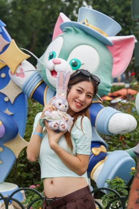 SHANGHAI, CHINA - JUNE 16: Tourists pose for photos with a sculpture themed for the 10th anniversary on June 16, 2026 in Shanghai, China. Shanghai Disney Resort has received over 100 million visits since its opening.  Copyright: xVCGx 111648625142