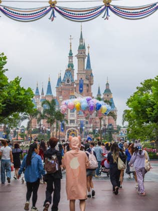 SHANGHAI, CHINA - JUNE 16: Visitors walk through Shanghai Disney Resort on June 16, 2026 in Shanghai, China. The theme park is celebrating its 10th anniversary since opening, having received over 100 million visits cumulatively.  Copyright: xVCGx 111648625145