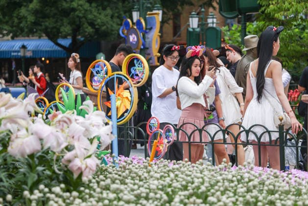 SHANGHAI, CHINA - JUNE 16: Visitors take photos at Shanghai Disney Resort on June 16, 2026 in Shanghai, China. The theme park marks its 10th anniversary since opening, having received over 100 million visits cumulatively.  Copyright: xVCGx 111648625143