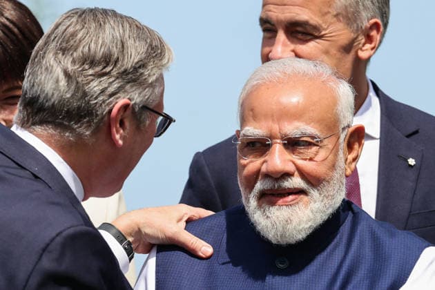 British Prime Minister Keir Starmer L speaks with Indian Prime Minister Narendra Modi during a group photo at the G7 summit in Evian, eastern France, on June 16, 2026. A G7 summit is scheduled to take place June 15–17 in the French town of Évian-les-Bains, near Switzerland, and will be attended by national leaders, as well as the EU’s foreign policy chief and ministers from Brazil, Canada, the United Arab Emirates, and Turkey. Ludovic Marin, Pool Bestimage, Évian-les-Bains, France,detected_source_language  Copyright: xLudovicxMarin Pool BestimagexLudovicxMarin Pool Bestimagex