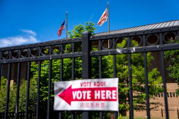 A Washington DC and American flag fly over Sherwood Recreation Center as people vote in Washington DC s 2026 primary elections on Tuesday, June 16, 2026. The two front-runners to succeed current DC Mayor Muriel Bowser are Kenyan McDuffie, a moderate with support from many of Bowser s cabinet, and Janeese Lewis George, democratic socialist who built her campaign around organized labor.  WAP20260616306 BONNIExCASH