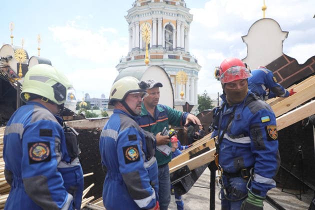 Rescuers from the Mobile Rapid Response Rescue Centre of the State Emergency Service of Ukraine construct a temporary protective cover over the destroyed roof of the Dormition Cathedral of the Kyiv Pechersk Lavra, which was hit by a Russian drone during a massive attack on the Ukrainian capital on Monday night, June 15, Kyiv, Ukraine, June 16, 2026. The strike triggered a large-scale fire that covered about 800 sq m and damaged 80% of the roof structure. (Photo by Yuliia Ovsiannikova Ukrinform) Briefing on aftermath of Russian attack on cultural heritage sites of Kyiv  Copyright: xYuliiaxOvsiannikovax