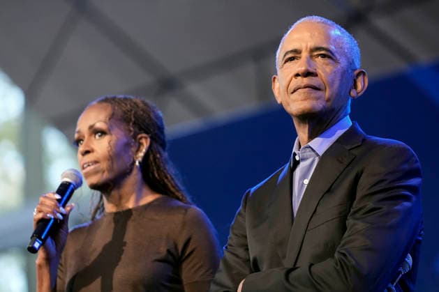 Former President Barack Obama listening to former first lady Michelle Obama speaking at a stakeholders event at the Obama Presidential Center, Tuesday, June 16, 2026, in Chicago, Illinois. The Obama Library officially opens to the public on Friday June 19, 2026. Pool  CHI2026061605 PabloxMartinezxMonsivais
