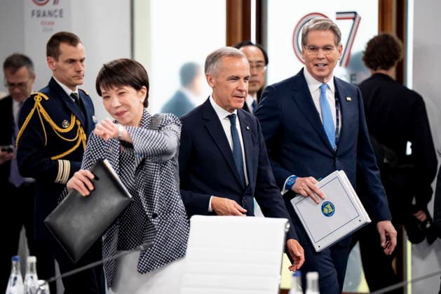 June 17, 2026, Evian-Les-Bains, France: Prime Minister of Japan, Sanae Takaichi looks at her watch as Prime Minister Mark Carney speaks to United States Secretary of the Treasury, Scott Bessent, ahead of a G7 working session at the G7 summit in Evian-les-Bains, France, on Wednesday, June 17, 2026. Evian-Les-Bains France  - ZUMAc35_ 20260617_zaf_c35_016 Copyright: xChristopherxKatsarovx