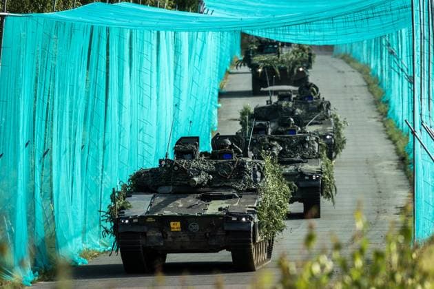 LOHHEIDE - A combat unit with CV90 armored vehicles drives through a corridor protected by anti-drone nets during the military exercise Fighter Lion at a training ground in Germany. The largest army exercise of 2026 focuses on defending the Netherlands and NATO territory in a changing security situation. VINCENT JANNINK netherlands out - belgium out  Copyright: xx x561245001x originalFilename: 561245001.jpg