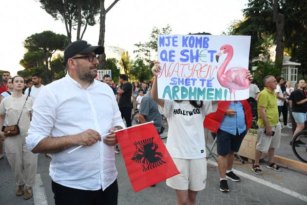 Anti-tourism project protests continue for 18th day in Albania TIRANA, ALBANIA - JUNE 17: Protests against a planned tourism project in the Zvernec area of the coastal city of Vlora continue for a 18th consecutive day in Tirana, Albania on June 17, 2026. Demonstrators gathered in Skanderbeg Square under the slogan Albania is not for sale, with a large number of participants joining the rally. Protesters opposed the reported sale of a beach in Zvernec as part of a tourism project allegedly linked to Ivanka Trump and Jared Kushner. Carrying banners, placards, and Albanian flags, demonstrators marched along the Boulevard of the Martyrs of the Nation toward the Prime Minister’s Office. Olsi Shehu Anadolu Tirana Albania. Editorial use only.  Copyright: x2026xAnadoluxOlsixShehux