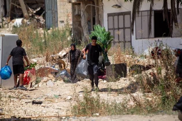 Displaced Families Granted Brief Access to Retrieve Belongings from Tulkarm Camp TULKARM REFUGEE CAMP, WEST BANK JUNE 17, 2026: Palestinian residents carry personal belongings after Israeli authorities allowed 45 families to enter Tulkarm refugee camp for a limited period to retrieve items from their homes. The visit comes amid the ongoing Israeli military operation in Tulkarm and Nur Shams refugee camps, which has displaced large numbers of residents and caused significant damage to homes and infrastructure. Photo by Mojahid Nawahda JNA Press. (Photo by Mojahid Nwahda JNA Press via Nexpher Images) TULKARM