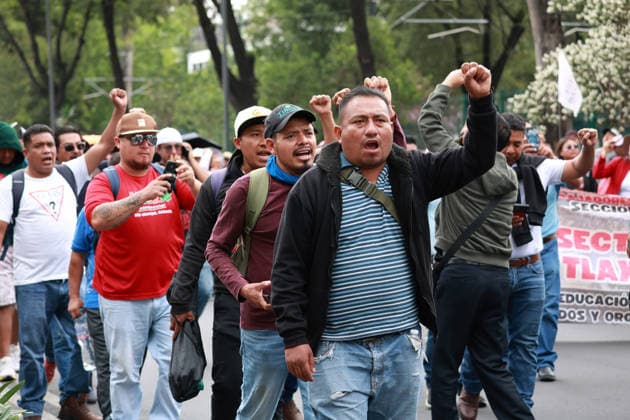CNTE teachers rally toward Banorte Stadium in Mexico City MEXICO CITY, MEXICO - JUNE 17: CNTE teachers raise their fists during a rally toward Banorte Stadium, in Mexico City, Mexico on June 17, 2026. Members of National Coordination of Education Workers (CNTE) held a rally toward Banorte Stadium hours before the Uzbekistan v Colombia match following failed talks with the Mexican government. Daniel Cardenas Anadolu Mexico City Mexico. Editorial use only. Please get in touch for any other usage.  Copyright: x2026xAnadoluxDanielxCardenasx