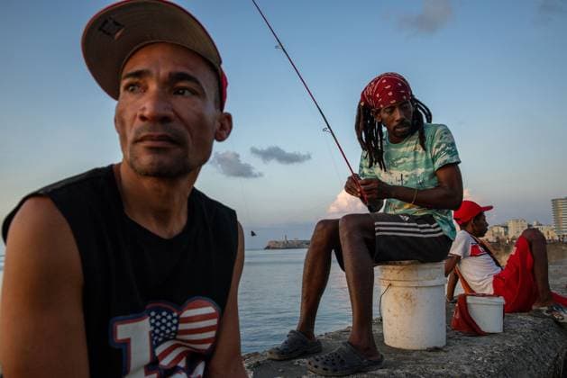 CUBA-HAVANA SOCIAL CRISIS AND WORLD CUP HAVANA, CUBA - JUNE 16, 2026: Fishermen prepare their fishing lines while sitting on buckets along the Malecon seawall late in the afternoon in Havana, Cuba, on June 16, 2026. Shoreline fishing remains a widespread practice across the capital as residents navigate severe protein shortages and inflated food prices in domestic markets. (Photo by Pablo Miranzo JNA Press via Nexpher Images) HAVANA