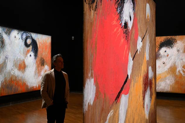 ARTHUR BOYD TAPESTRIES EXHIBITION, A guest takes a look at tapestries during a media preview of a major winter exhibition ˜Arthur Boyd: Tapestries™ at the National Gallery of Australia in Canberra, Thursday, June 18, 2026. At 2.5 by 3.4 metres, each tapestry features a scene from the life of St Francis of Assisi, one of the most venerated figures in history. ( NO ARCHIVING CANBERRA AUSTRALIAN CAPITAL TERRITORY AUSTRALIA  Copyright: xLUKASxCOCHx 20260618191895075587