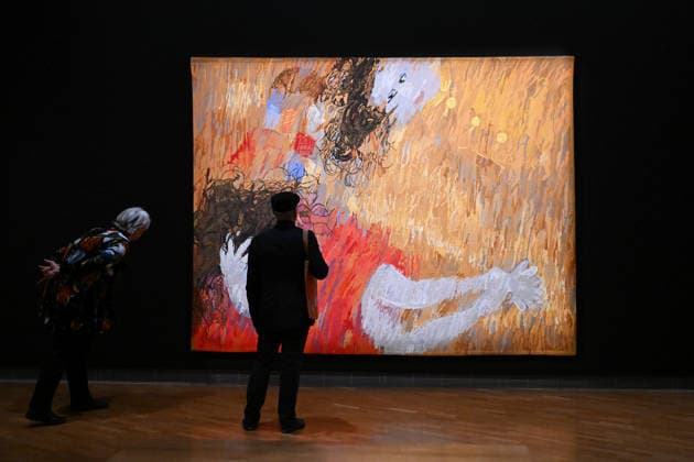 ARTHUR BOYD TAPESTRIES EXHIBITION, Guests take a look at a tapestry during a media preview of a major winter exhibition ˜Arthur Boyd: Tapestries™ at the National Gallery of Australia in Canberra, Thursday, June 18, 2026. At 2.5 by 3.4 metres, each tapestry features a scene from the life of St Francis of Assisi, one of the most venerated figures in history. ( NO ARCHIVING CANBERRA AUSTRALIAN CAPITAL TERRITORY AUSTRALIA  Copyright: xLUKASxCOCHx 20260618111593831850