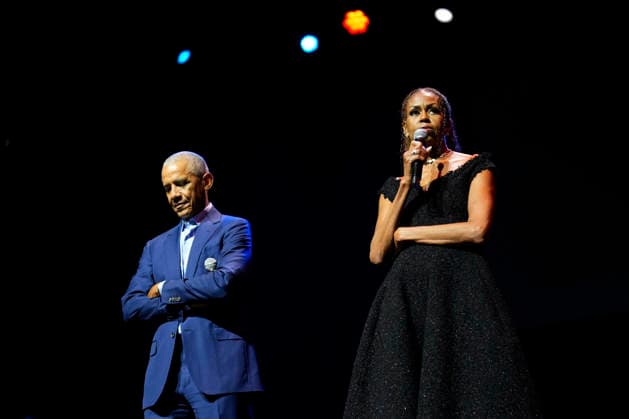 Former President Barack Obama and former first lady Michelle Obama appear on stage as they surprised administration and campaign alumni in Chicago ahead of the dedication ceremony of the Obama Presidential Center, Wednesday, June 17, 2026. Pool  CHX20260617205 PabloxMartinezxMonsivais