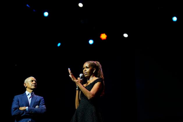 Former President Barack Obama and former first lady Michelle Obama appear on stage as they surprised administration and campaign alumni in Chicago ahead of the dedication ceremony of the Obama Presidential Center, Wednesday, June 17, 2026. Pool  CHX20260617208 PabloxMartinezxMonsivais