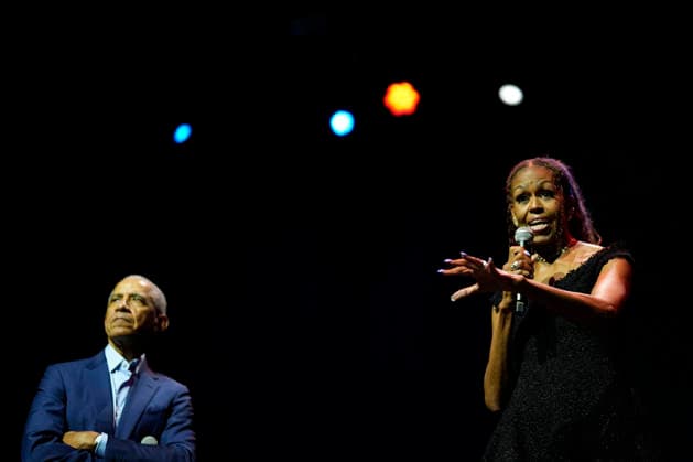 Former President Barack Obama and former first lady Michelle Obama appear on stage as they surprised administration and campaign alumni in Chicago ahead of the dedication ceremony of the Obama Presidential Center, Wednesday, June 17, 2026. Pool  CHX20260617209 PabloxMartinezxMonsivais