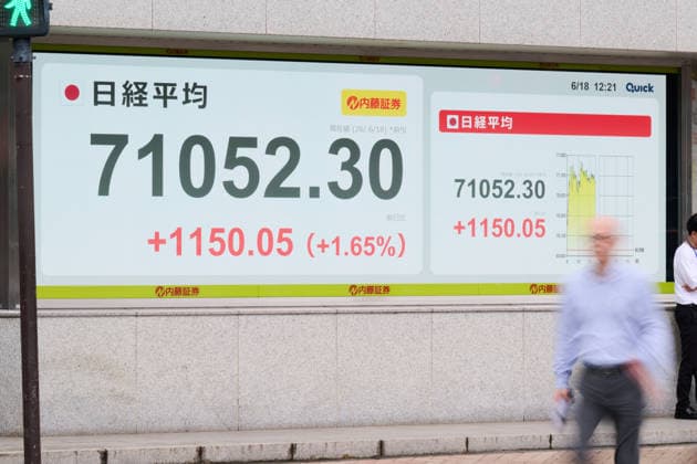 A picture shows the Nikkei Stock Average displayed on an electronic board in Tokyo, Japan, on June 18, 2026. The Nikkei Stock Average rose above 71,000 on Thursday for the first time ever.  aflo_334859410