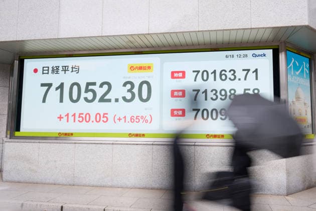 A picture shows the Nikkei Stock Average displayed on an electronic board in Tokyo, Japan, on June 18, 2026. The Nikkei Stock Average rose above 71,000 on Thursday for the first time ever.  aflo_334859416
