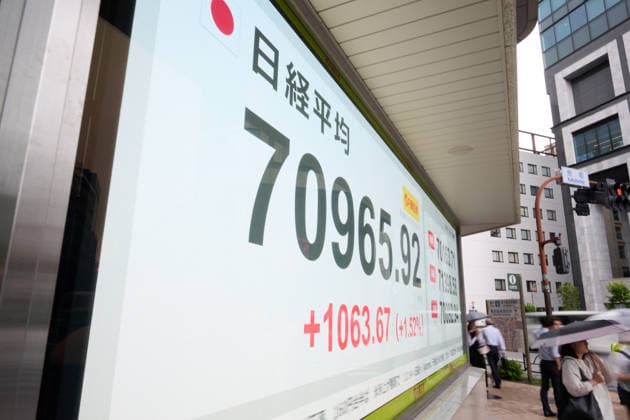 A picture shows the Nikkei Stock Average displayed on an electronic board in Tokyo, Japan, on June 18, 2026. The Nikkei Stock Average rose above 71,000 on Thursday for the first time ever.  aflo_334859448