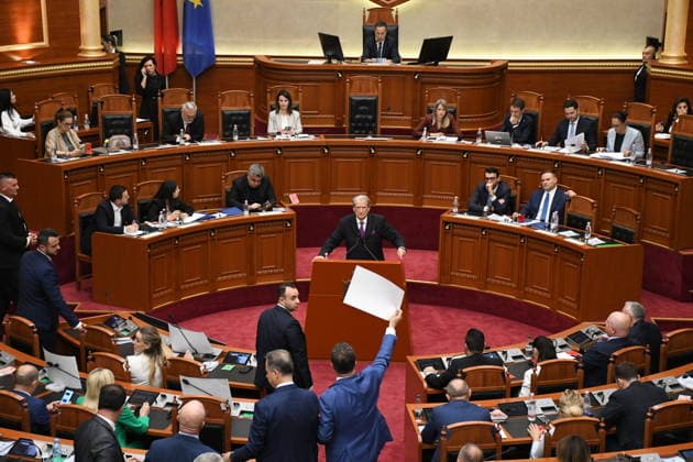 Opposition MPs in Albania block the parliamentary podium TIRANA, ALBANIA - JUNE 18: Opposition MPs unfurl banners in support of the demonstrations as session of the Albanian Parliament is interrupted several times after MPs from the main opposition party, the Democratic Party (PD), block the podium in Tirana, Albania on June 18, 2026. The agenda for the parliamentary session included a briefing by Ferit Hoxha, Minister for European and Foreign Affairs, on the country’s accession negotiations with the European Union (EU), and the discussion of several draft laws. After Parliamentary Speaker Niko Peleshi gave the floor to Minister Hoxha, PD MPs blocked the podium, demanding that the floor be given to the party’s leader, Sali Berisha. Olsi She  Copyright: x2026xAnadoluxOlsixShehux