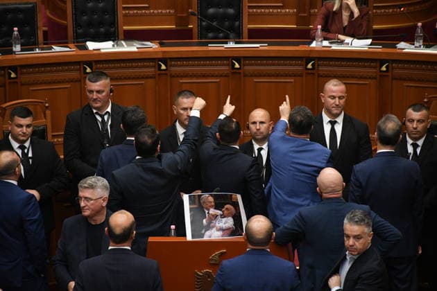 Opposition MPs in Albania block the parliamentary podium TIRANA, ALBANIA - JUNE 18: Opposition MPs unfurl banners in support of the demonstrations as session of the Albanian Parliament is interrupted several times after MPs from the main opposition party, the Democratic Party (PD), block the podium in Tirana, Albania on June 18, 2026. The agenda for the parliamentary session included a briefing by Ferit Hoxha, Minister for European and Foreign Affairs, on the country’s accession negotiations with the European Union (EU), and the discussion of several draft laws. After Parliamentary Speaker Niko Peleshi gave the floor to Minister Hoxha, PD MPs blocked the podium, demanding that the floor be given to the party’s leader, Sali Berisha. Olsi She  Copyright: x2026xAnadoluxOlsixShehux