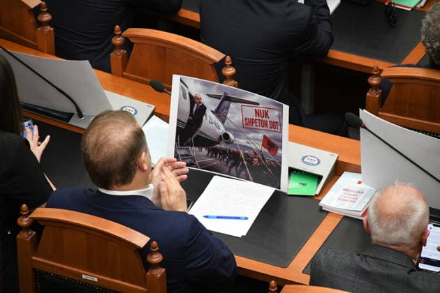 Opposition MPs in Albania block the parliamentary podium TIRANA, ALBANIA - JUNE 18: Opposition MPs unfurl banners in support of the demonstrations as session of the Albanian Parliament is interrupted several times after MPs from the main opposition party, the Democratic Party (PD), block the podium in Tirana, Albania on June 18, 2026. The agenda for the parliamentary session included a briefing by Ferit Hoxha, Minister for European and Foreign Affairs, on the country’s accession negotiations with the European Union (EU), and the discussion of several draft laws. After Parliamentary Speaker Niko Peleshi gave the floor to Minister Hoxha, PD MPs blocked the podium, demanding that the floor be given to the party’s leader, Sali Berisha. Olsi She  Copyright: x2026xAnadoluxOlsixShehux