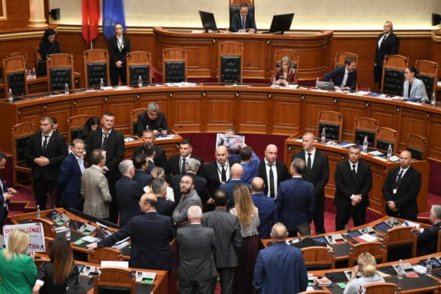 Opposition MPs in Albania block the parliamentary podium TIRANA, ALBANIA - JUNE 18: Opposition MPs unfurl banners in support of the demonstrations as session of the Albanian Parliament is interrupted several times after MPs from the main opposition party, the Democratic Party (PD), block the podium in Tirana, Albania on June 18, 2026. The agenda for the parliamentary session included a briefing by Ferit Hoxha, Minister for European and Foreign Affairs, on the country’s accession negotiations with the European Union (EU), and the discussion of several draft laws. After Parliamentary Speaker Niko Peleshi gave the floor to Minister Hoxha, PD MPs blocked the podium, demanding that the floor be given to the party’s leader, Sali Berisha. Olsi She  Copyright: x2026xAnadoluxOlsixShehux
