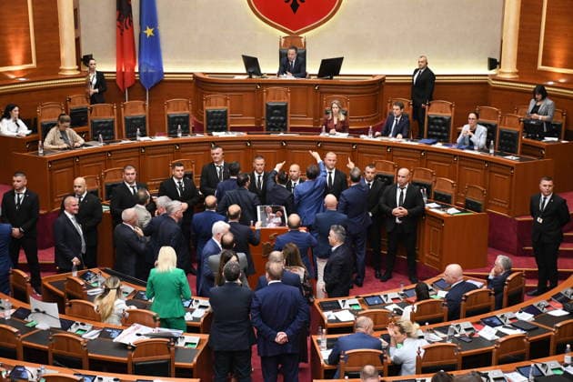 Opposition MPs in Albania block the parliamentary podium TIRANA, ALBANIA - JUNE 18: Opposition MPs unfurl banners in support of the demonstrations as session of the Albanian Parliament is interrupted several times after MPs from the main opposition party, the Democratic Party (PD), block the podium in Tirana, Albania on June 18, 2026. The agenda for the parliamentary session included a briefing by Ferit Hoxha, Minister for European and Foreign Affairs, on the country’s accession negotiations with the European Union (EU), and the discussion of several draft laws. After Parliamentary Speaker Niko Peleshi gave the floor to Minister Hoxha, PD MPs blocked the podium, demanding that the floor be given to the party’s leader, Sali Berisha. Olsi She  Copyright: x2026xAnadoluxOlsixShehux