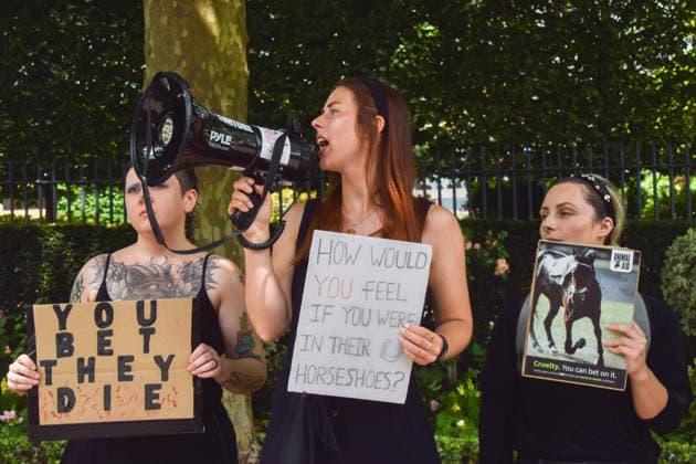 June 18, 2026, Ascot, England, United Kingdom: Animal rights activists from the group Animal Aid stage a protest outside Ascot Racecourse during Royal Ascot 2026, calling for an end to horse racing. Campaigners say that around 200 racehorses die each year in the UK. Ascot United Kingdom  - ZUMAv130 20260618_zip_v130_026 Copyright: xVukxValcicx