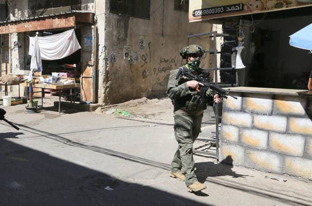 June 18, 2026, Nablus, West Bank, Palestine: Israeli soldiers are positioned in the center of the market during a raid on Balata refugee camp east of Nablus in the West Bank. Israeli forces raided the central market during a security operation. Palestinian sources said that the army arrested seven Palestinians from various neighborhoods in Nablus and its surrounding refugee camps. Nablus Palestine - ZUMAs197 20260618_aaa_s197_010 Copyright: xNasserxishatyehx