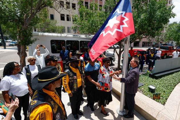 June 18, 2026, Tampa, Florida, USA: Hillsborough County Commissioner Gwen Myers helps raise the Juneteenth flag during the annual Juneteenth Flag-Raising ceremony outside the Fred B. Karl County Center on Thursday, June 18, 2026, in Tampa. Tampa USA - ZUMAs70_ 20260618_zan_s70_015 Copyright: xJeffereexWoox
