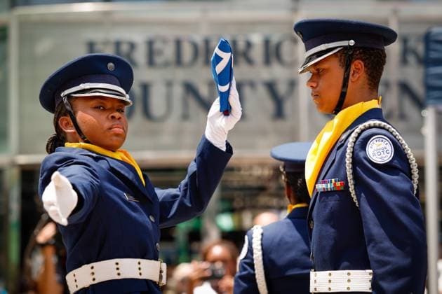June 18, 2026, Tampa, Florida, USA: LaÃ¢â‚¬â ¢titeyanna Nixon, left, and Austin Guerrero Cruz, with the Howard W. Blake High School Air Force Junior ROTC, present and unveil the Juneteenth flag during the annual Juneteenth Flag-Raising ceremony outside the Fred B. Karl County Center on Thursday, June 18, 2026, in Tampa. Tampa USA - ZUMAs70_ 20260618_zan_s70_012 Copyright: xJeffereexWoox