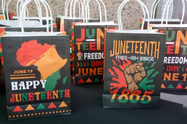 June 18, 2026, Tampa, Florida, USA: Bags are handed out with holiday decorations during the annual Juneteenth Flag-Raising ceremony outside the Fred B. Karl County Center on Thursday, June 18, 2026, in Tampa. Tampa USA - ZUMAs70_ 20260618_zan_s70_001 Copyright: xJeffereexWoox