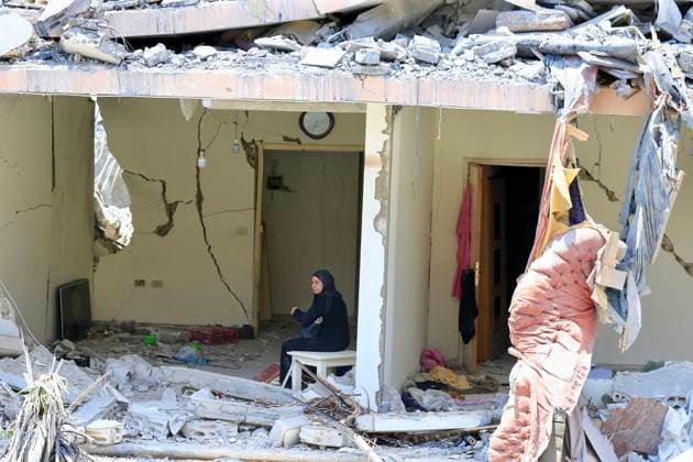 (260618) -- NABATIEH, June 18, 2026 -- Photo taken on June 18, 2026 shows a woman sitting in a destroyed building after Israeli attacks in Nabatieh, southern Lebanon. (Photo by Xinhua) LEBANON-NABATIEH-ISRAELI ATTACKS-AFTERMATH AlixHashisho 