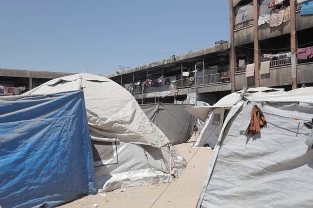 Jabalia Gaza Strip Displacement Crisis Tents sheltering displaced Palestinians stand in the courtyard of the Al-Faluja School shelter in Jabalia, in the northern Gaza Strip, on June 18, 2026. Thousands of displaced families in northern Gaza rely on humanitarian assistance as shortages of food, water and basic supplies persist amid the continuing conflict and humanitarian crisis. Gaza Gaza Strip Palestinian Territories Copyright: xAhmedxAlxArinix